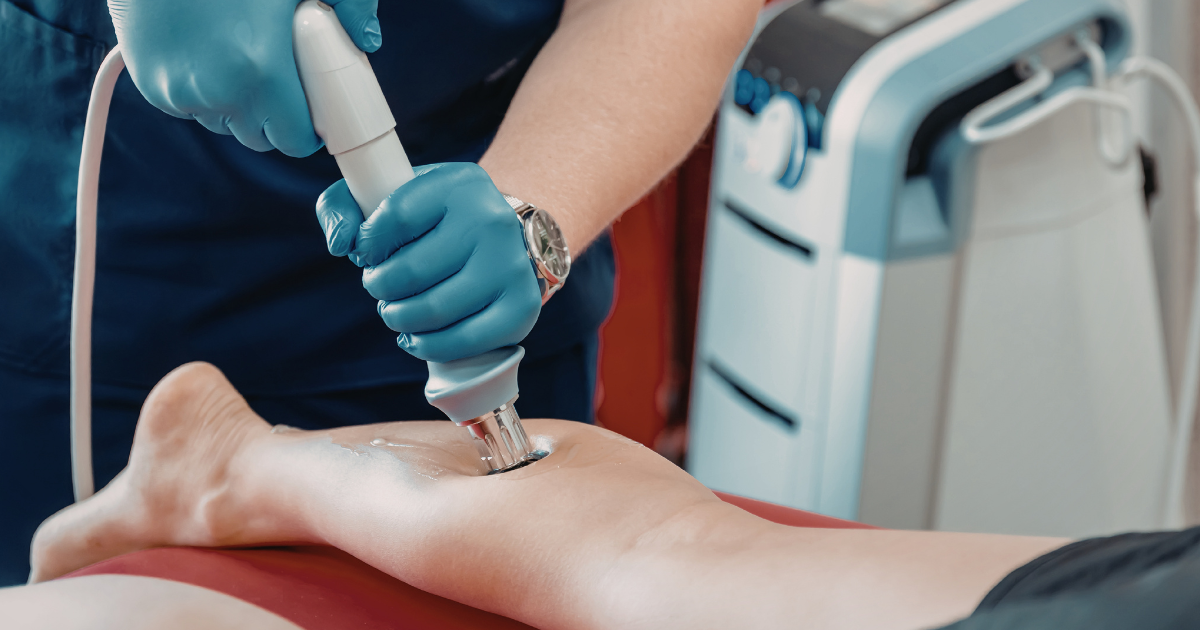 Vein specialist performing a minimally invasive vein restoration treatment on a patient’s leg.