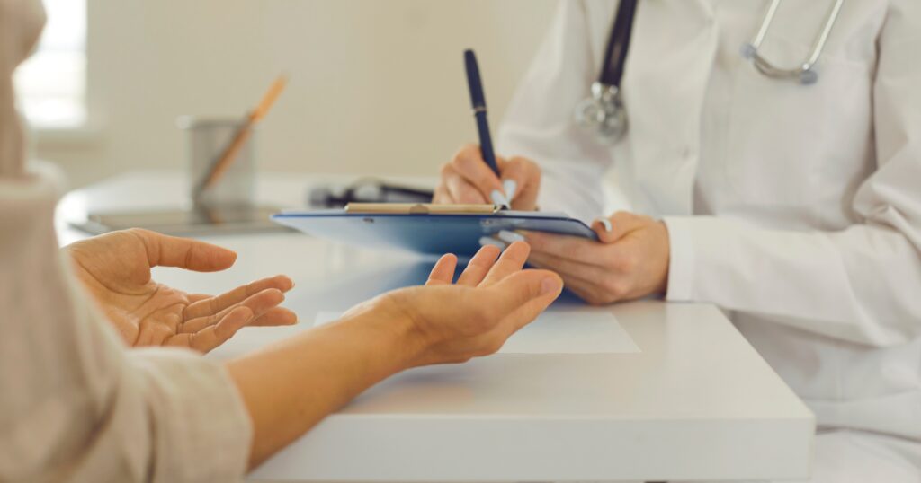 patient talking with a vein specialist