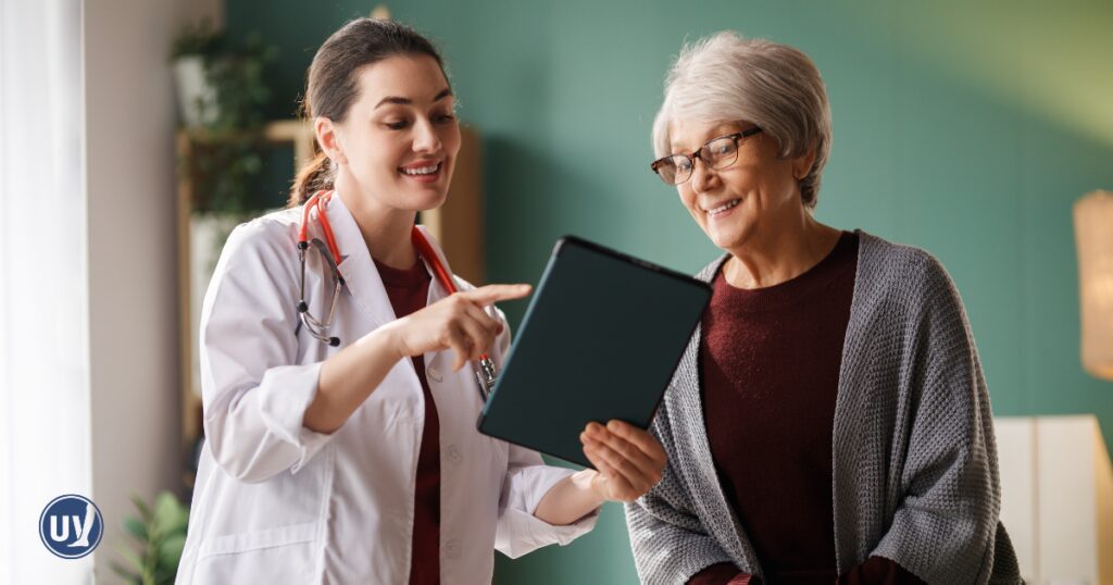 Older woman discussing treatment options for tired heavy legs
