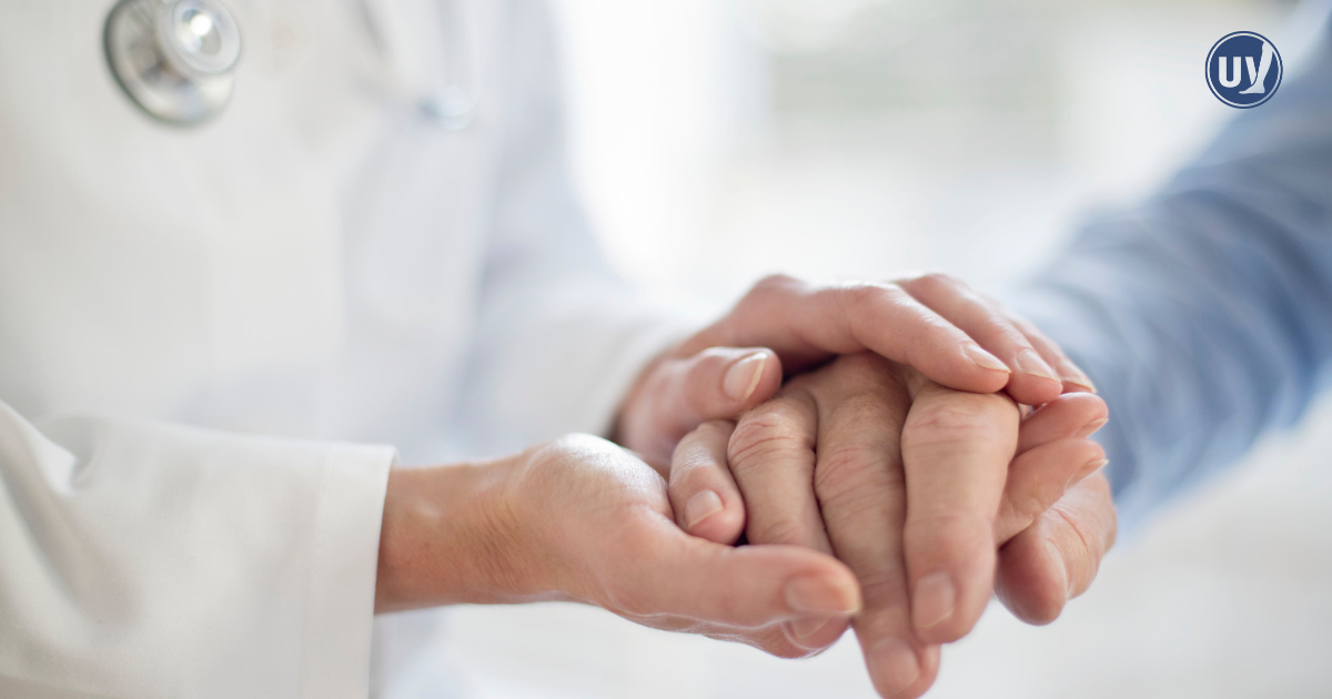 Vein doctor comforting patient.