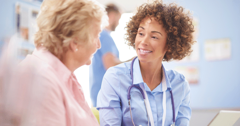 Vein specialist discussing vein treatment plans with patient.