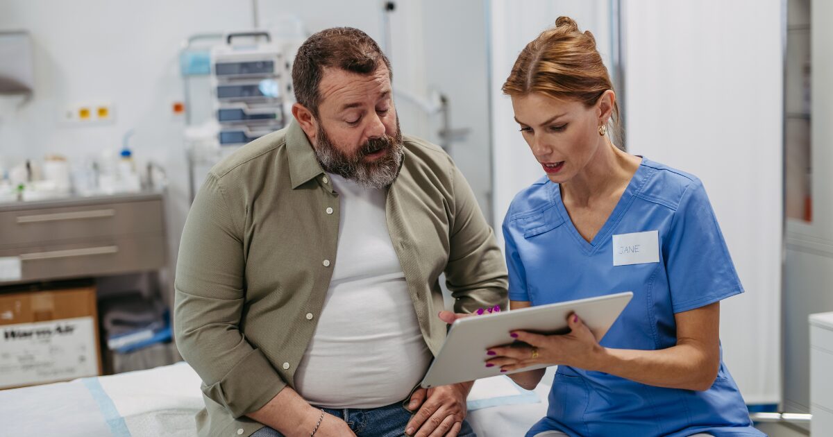 Vascular specialist with patient