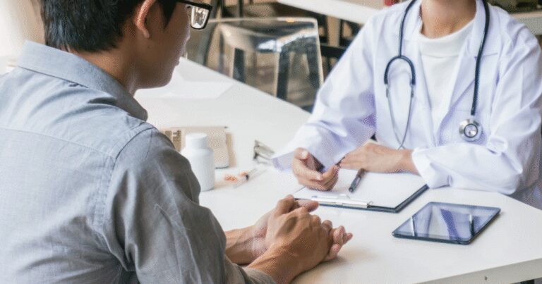 discussing venaseal treatment with vein specialist