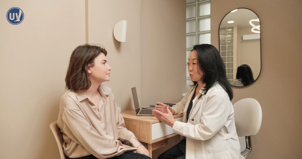 Vascular specialist discussing treatment options with woman.
