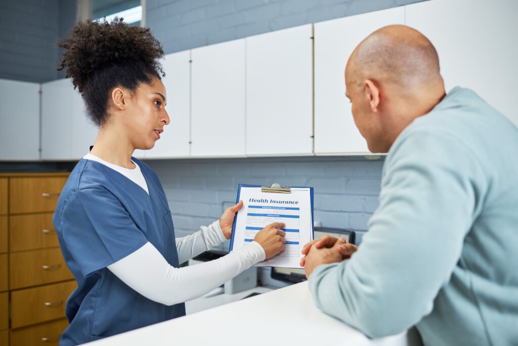 A vein doctor and patient discussing varicose vein treatment options