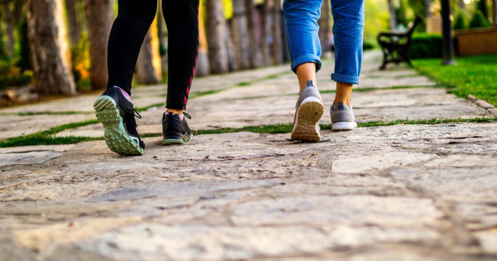 Two people walking during Houston summer heat