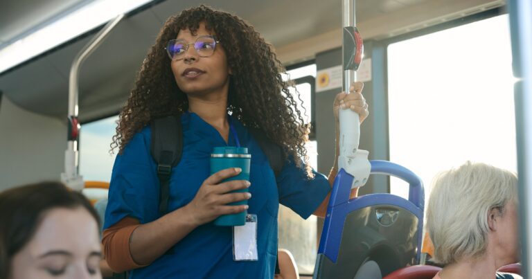 Woman commuting in Atlanta illustrating how standing or sitting for too long can cause vein issues