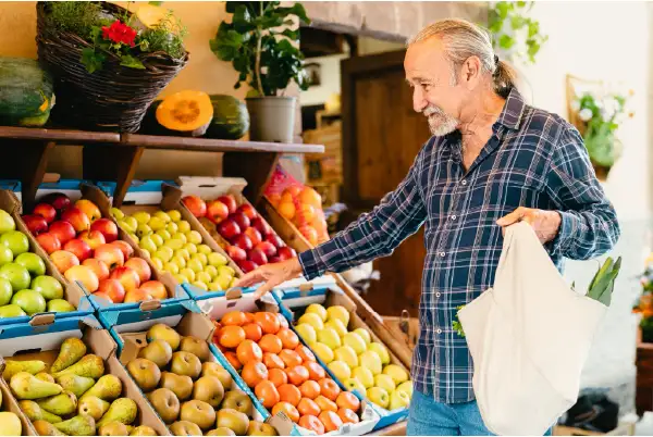 Senior man choosing fruit for good vein health