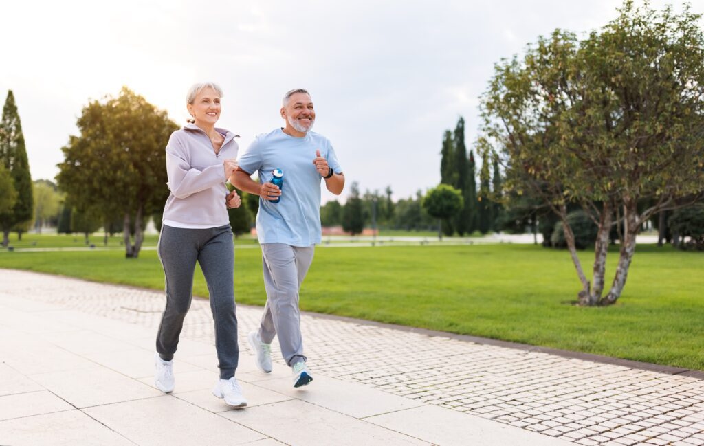 A man and woman walking together to prevent vein disease