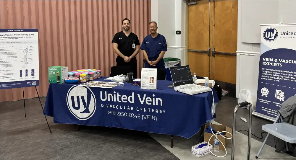 A United Vein & Vascular Centers booth for vein health education set up at the Venice, FL health fair