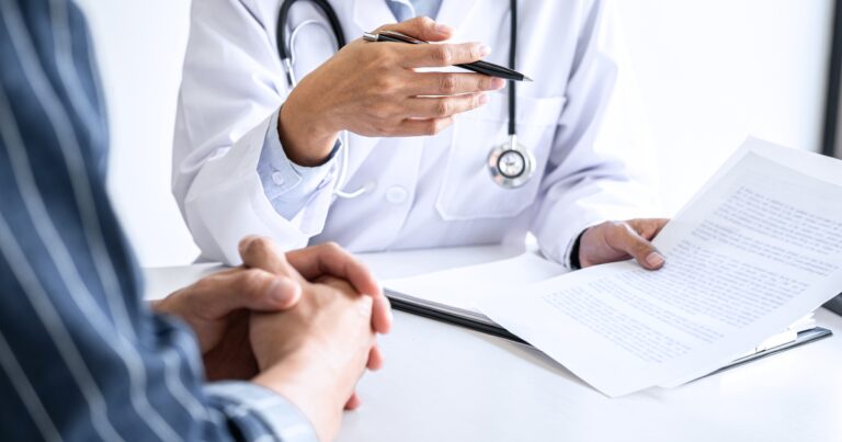 Vein specialist in Goodyear discussing vein treatment options and insurance coverage with patient