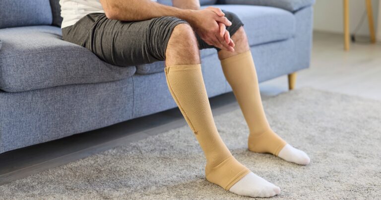 Patient wearing compression stockings after vein treatment in Mesa AZ