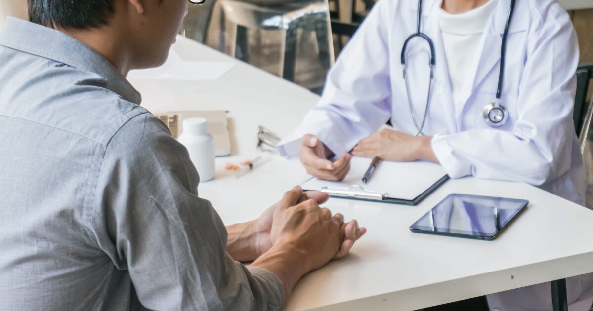 vascular specialist discussing Vascular Care in Phoenix with patient