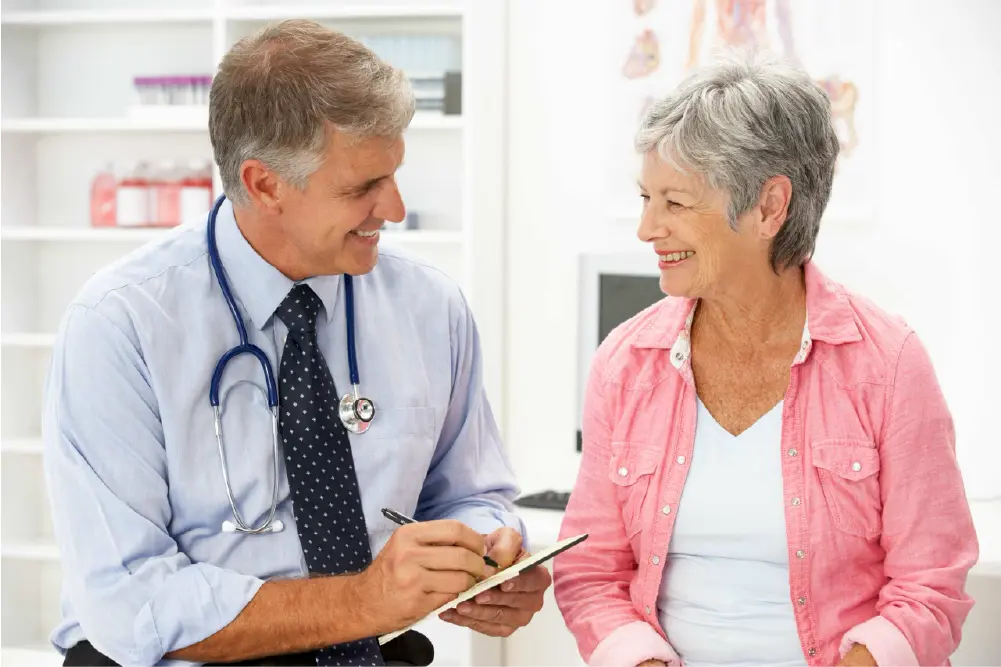 A senior woman discussing Varithena for varicose veins with her doctor